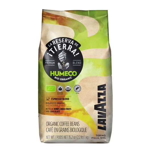 A bag of Lavazza Humeco Bio-Organic Espresso Blend coffee beans, featuring a green, beige, and brown design with a prominent black circular logo.